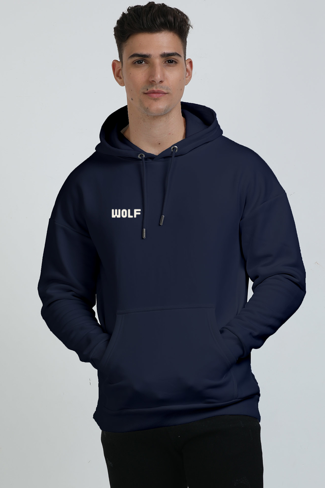 A man wearing a Navy Blue hoodie with a  text 'WOLF' on the pocket area of hoodie.