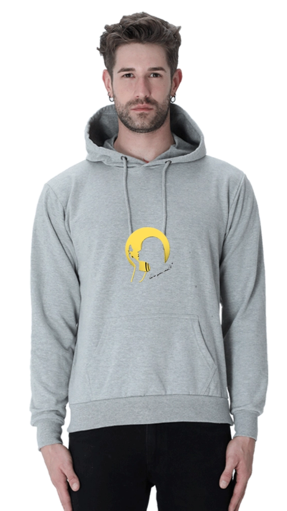 Person wearing a Melange gray hoodie with a yellow graphic design on a white background