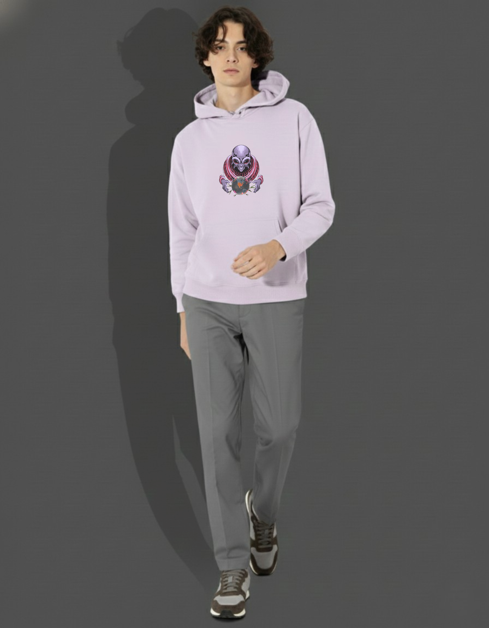 Man modeling Lavender 320 GSM Hoodie. Crsytal ball urban graphic on chest. Oversized fit.
