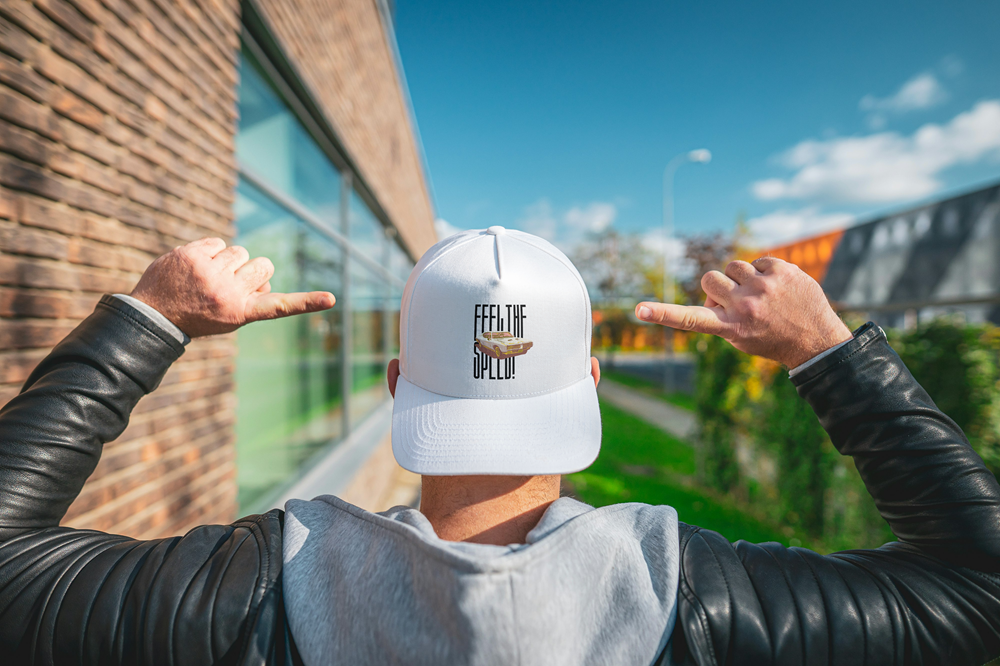 white cap with feel the speed and a pontiac gto image placed between the text