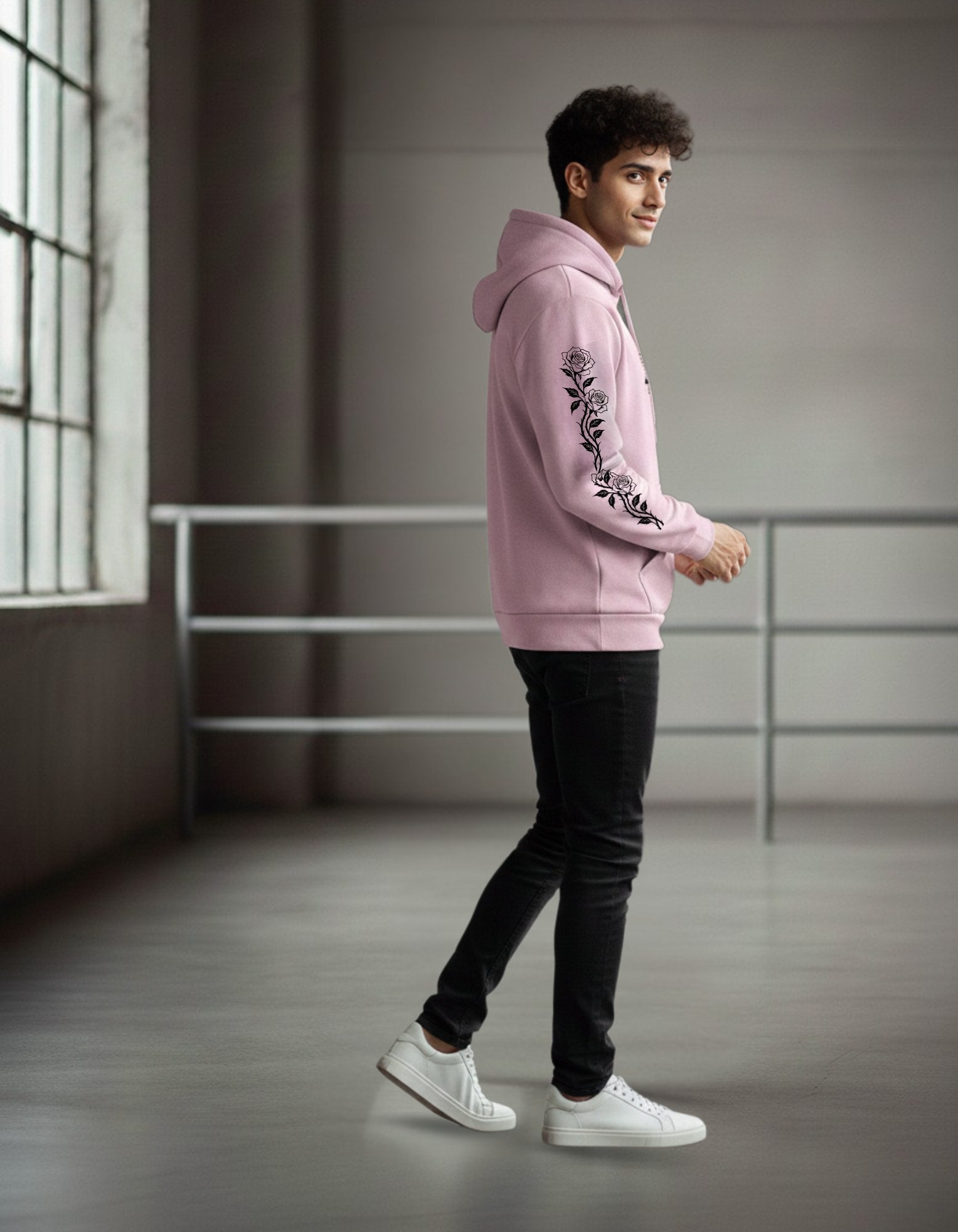 Side view of Light Pink Heavyweight Hoodie. Unisex fit with rose vine sleeve print. 320 GSM fleece.