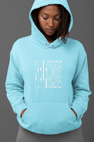 Female model in Baby Blue 300 GSM hoodie with a 'Self Made' statement graphic for street style and layering.