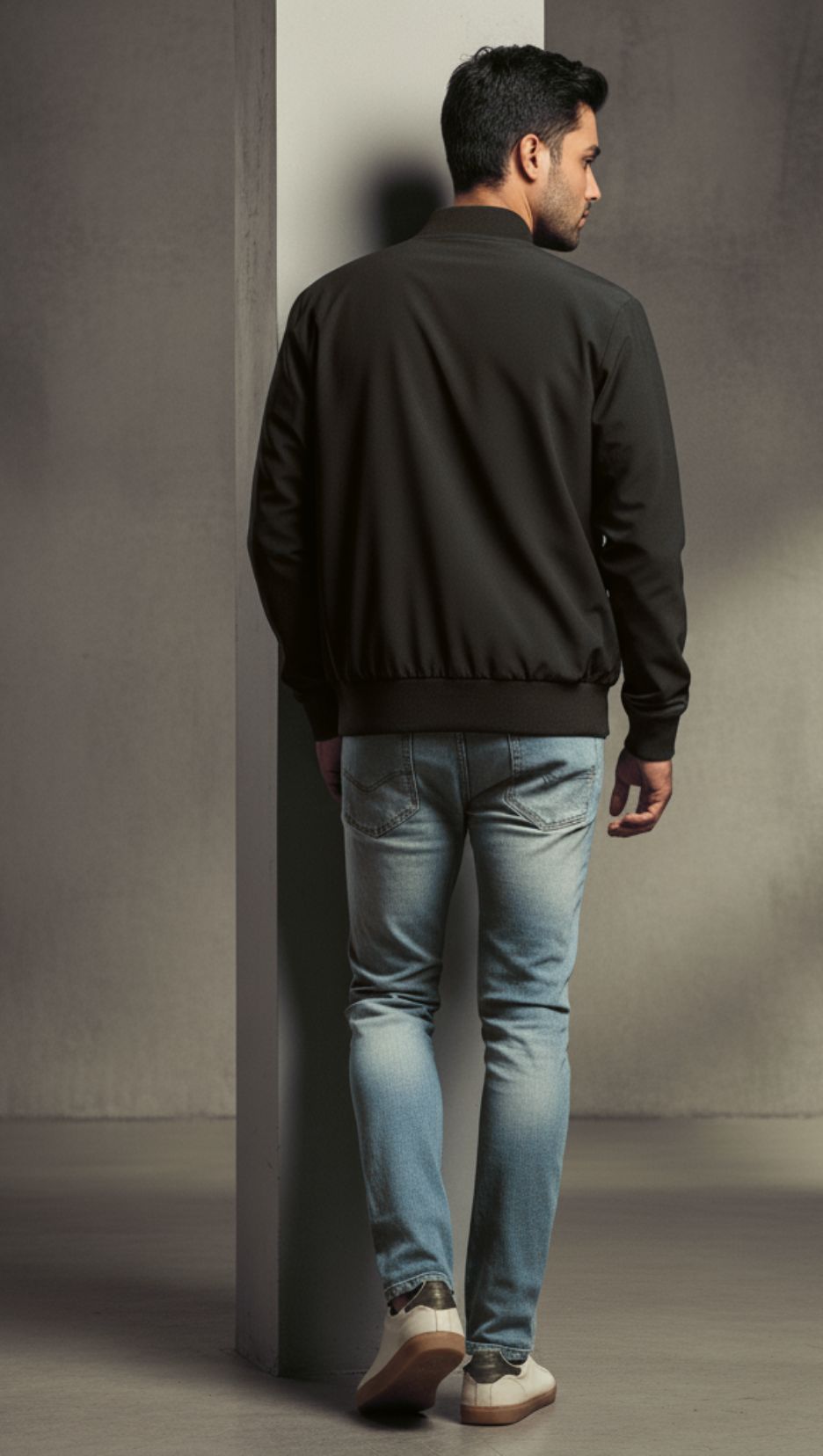 Back view of a man wearing 
-Black Unisex Ride Club Bomber Jacket (320 GSM), showcasing the white motorcycle and red text as pocket print.