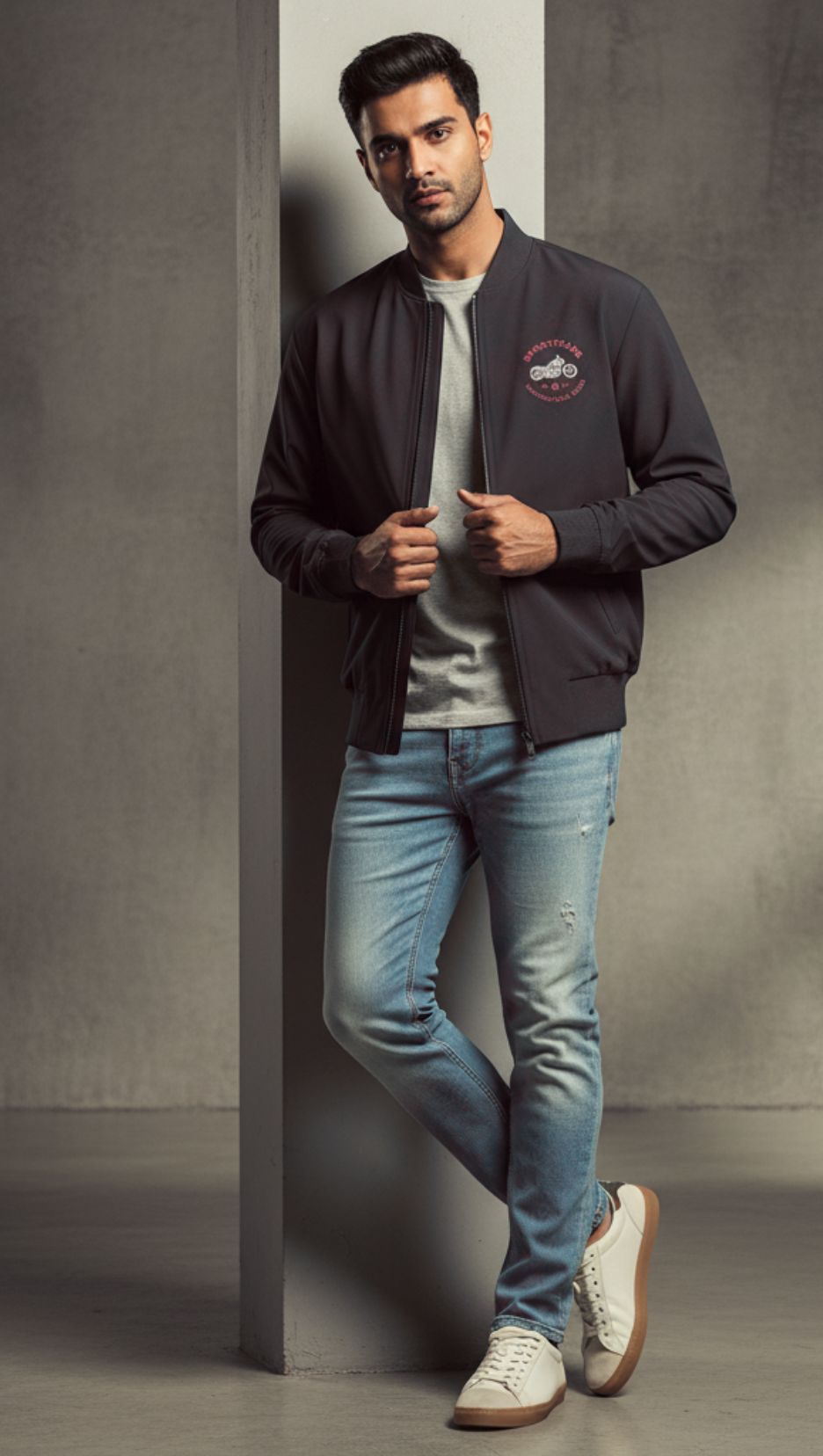 Front view of man wearing Black Unisex Ride Club Bomber Jacket (320 GSM), showcasing the white motorcycle and red text as pocket print.