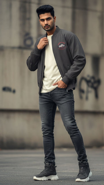 Side view of men wearing Chorcoal  Gray Color Unisex Ride Club Bomber Jacket (320 GSM), showcasing the white motorcycle and red text as pocket print.