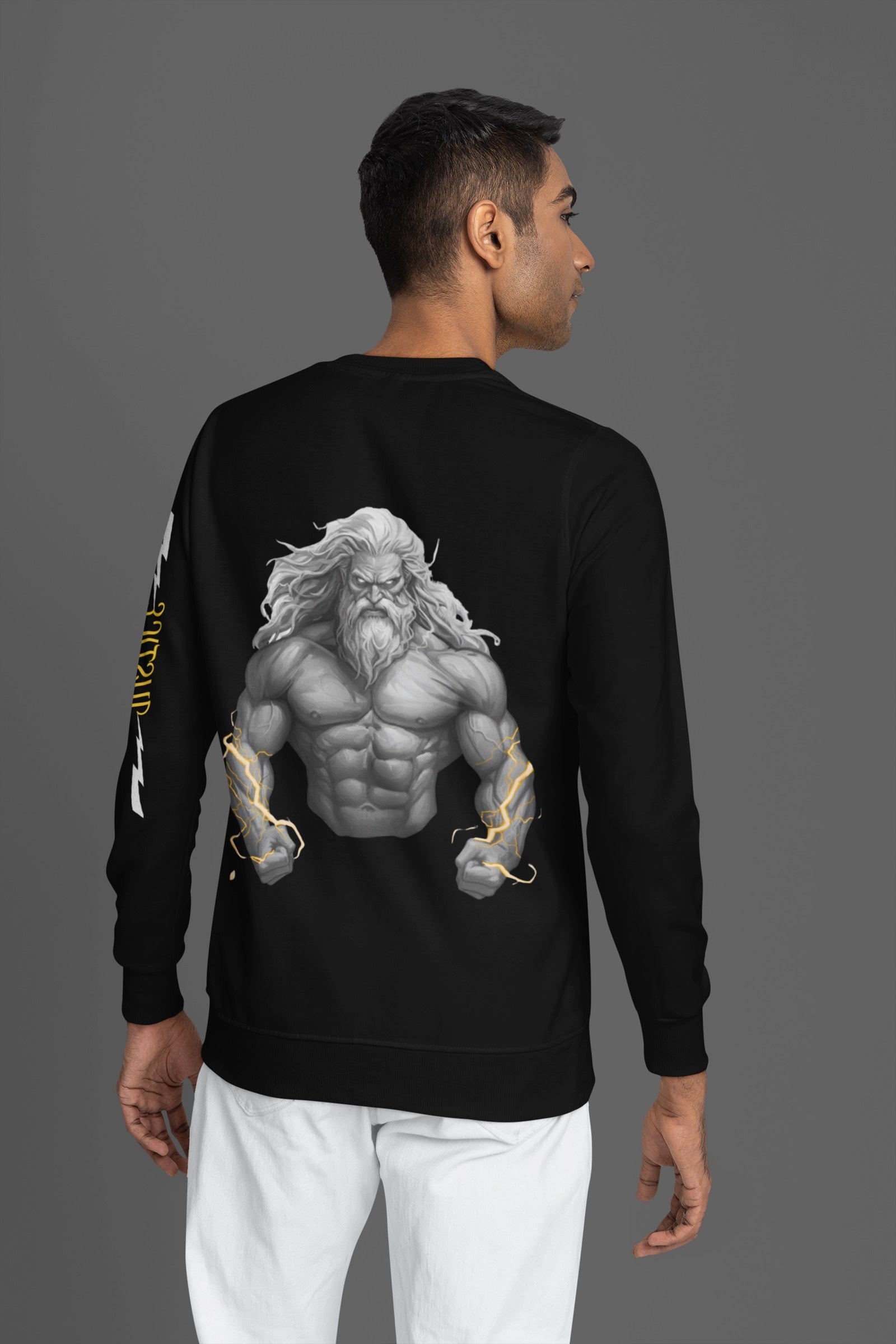 back pose of Model in black sweatshirt with a zeus design on back with justice text with white lightning on sleeves highlights