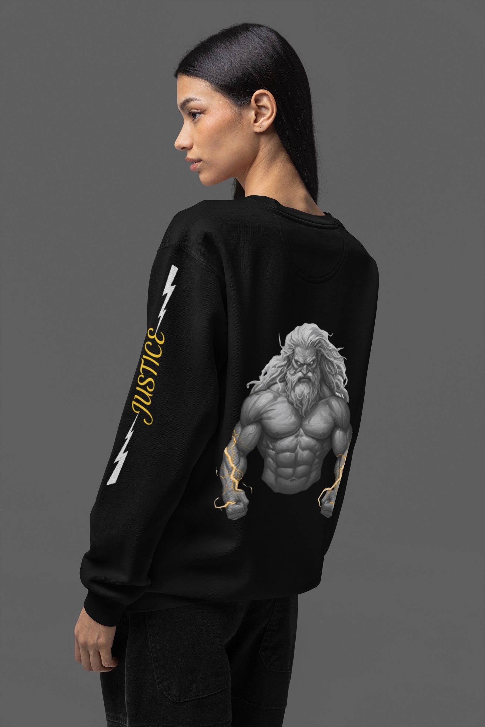 Person wearing a black sweatshirt with a greek god top half on back against a gray background.