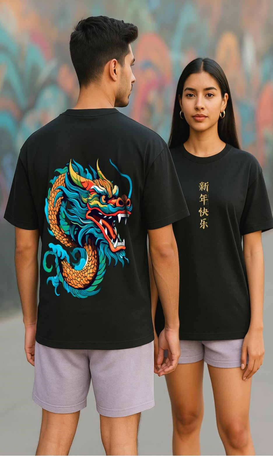 Two people wearing oversized black t-shirts with a colorful dragon design in back and dragon written in Chinese in front.